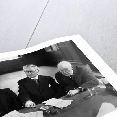 1930s 1940s Elderly Businessmen Sitting At Conference Table With Attention Directed To Speaker Not Shown by Anonymous