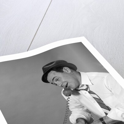 1960s Reporter With Hat On Phone At Typewriter by Anonymous