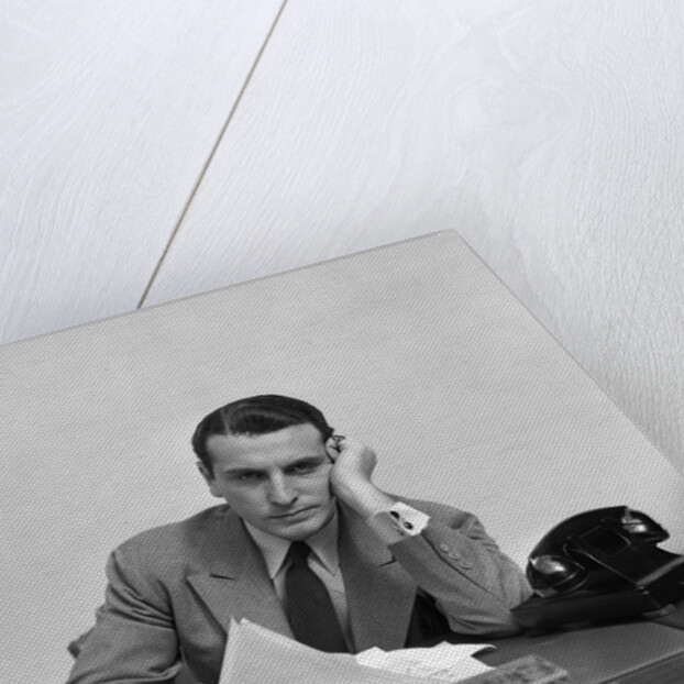 1940s Tired Overworked Man Businessman Leaning On Elbow Looking At Camera by Anonymous