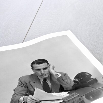 1940s Tired Overworked Man Businessman Leaning On Elbow Looking At Camera by Anonymous