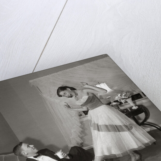 1950s 1960s Teen Couple Dressed for Prom, Girl Dancing To Music From A Record Player by Anonymous
