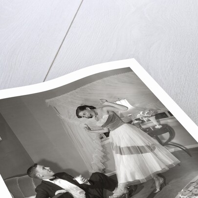 1950s 1960s Teen Couple Dressed for Prom, Girl Dancing To Music From A Record Player by Anonymous