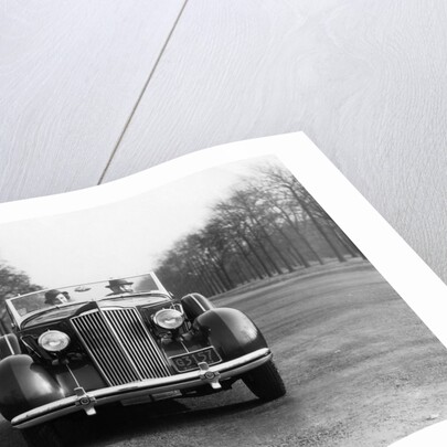 1930s 1935 Couple Driving Packard Convertible Automobile by Anonymous