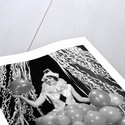 1920s 1930s Young Woman Pierrot Clown Amid Party Balloons And Paper Streamers by Corbis