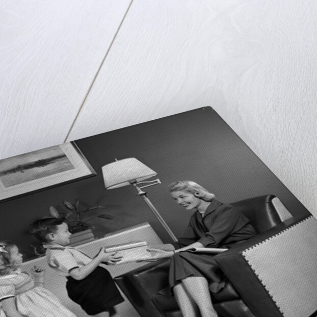 1950s Little Boy And Girl Son And Daughter Giving Woman Mother Sitting In Living Room A Gift Present by Anonymous