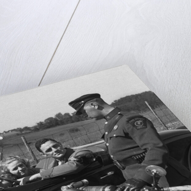 1930s Couple In Convertible Coupe Stopped By Motorcycle Cop Checking License Of Driver by Anonymous