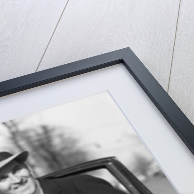 1930s Man In Suit And Hat Holding Gloves Stepping Into Automobile Driver Seat by Anonymous