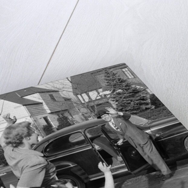 1950s Mother And Daughter Waving To Father Opening Automobile Door In Front Of Suburban Home by Anonymous