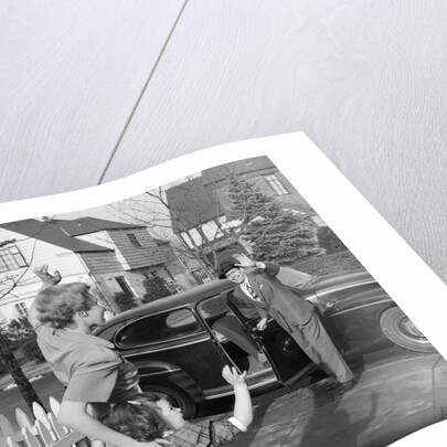 1950s Mother And Daughter Waving To Father Opening Automobile Door In Front Of Suburban Home by Anonymous