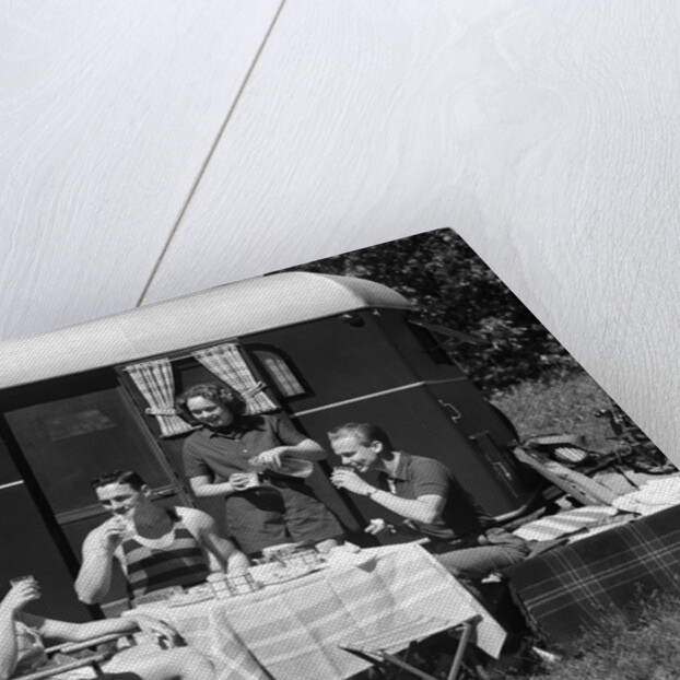 1930s Two Couples Eating Picnic Lunch Beside Camping Trailer by Anonymous