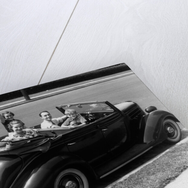 1940s Family Of Four In Convertible Ford V-8 Sedan At Camera by Anonymous