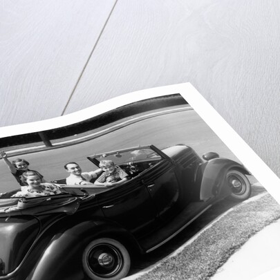 1940s Family Of Four In Convertible Ford V-8 Sedan At Camera by Anonymous