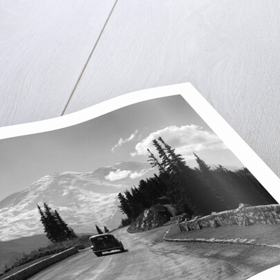 1930s Sedan Automobile Driving High Mountain Road Towards Snow Capped Mount Rainier Washington State Usa by Anonymous