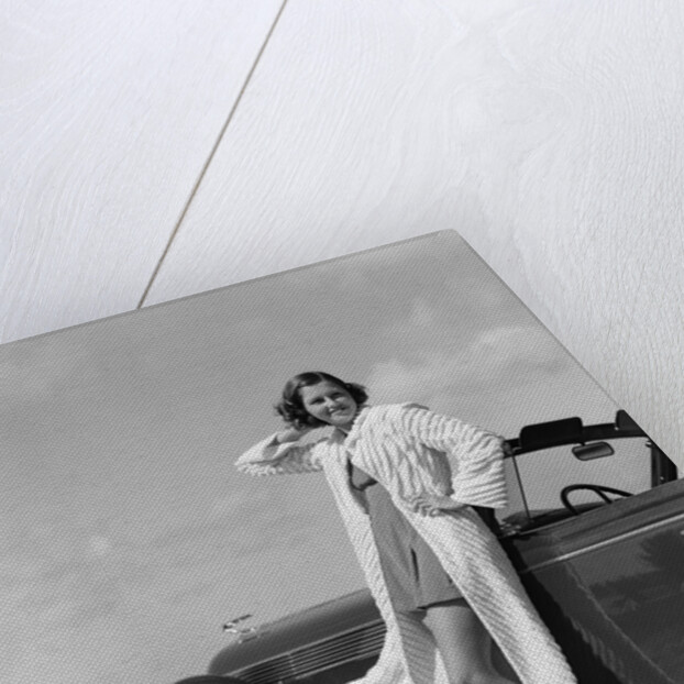 1930s 1940s Woman Wearing Chenille Beach Robe Posing On Running Board Of Convertible Roadster Automobile by Anonymous