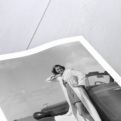 1930s 1940s Woman Wearing Chenille Beach Robe Posing On Running Board Of Convertible Roadster Automobile by Anonymous