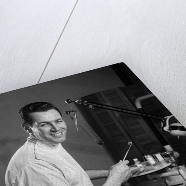 1960s Portrait Man Professional Dentist Holding Dental Tool Mirror by Anonymous