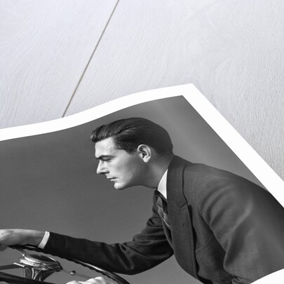 1930s 1940s Man Wearing Suit And Tie Holding Automobile Steering Wheel by Anonymous