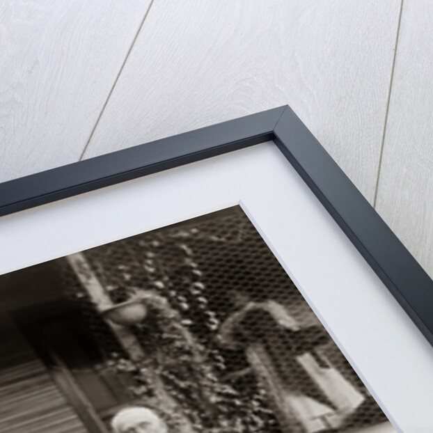 1890s 1900s Portrait Senior Couple Seated In Garden Man Holding Ear Trumpet by Anonymous