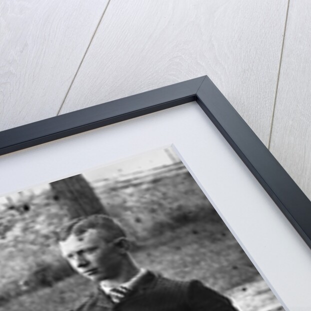 1890s 1900s Side View Of Man Wearing Suit Seated On Chair Outside Holding Bowler Hat by Anonymous