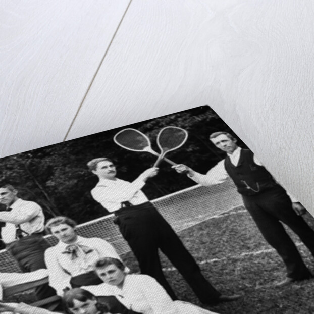 1890s 1900 Men Holding Racquets and Women and One Child In Front Of Net On Grass Tennis Court by Anonymous