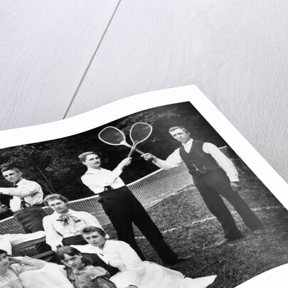 1890s 1900 Men Holding Racquets and Women and One Child In Front Of Net On Grass Tennis Court by Anonymous