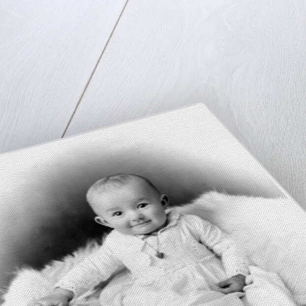 1890s 1900 Portrait Baby In Long Dress Wearing Heart Locket Sitting On White Fur Blanket by Anonymous