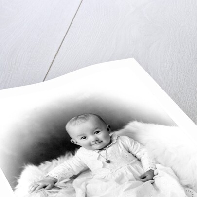 1890s 1900 Portrait Baby In Long Dress Wearing Heart Locket Sitting On White Fur Blanket by Anonymous