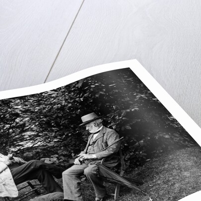 1900 Two Men Sitting Outside In Chairs Among Trees Smoking Cigars Talking Dog Laying At Their Feet by Anonymous