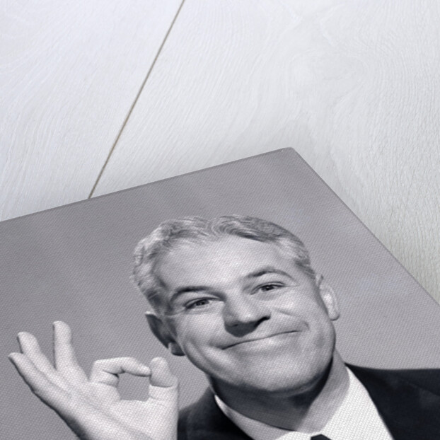 1950s Portrait Of Happy Man Businessman Slesman Making An Ok Hand Sign by Anonymous