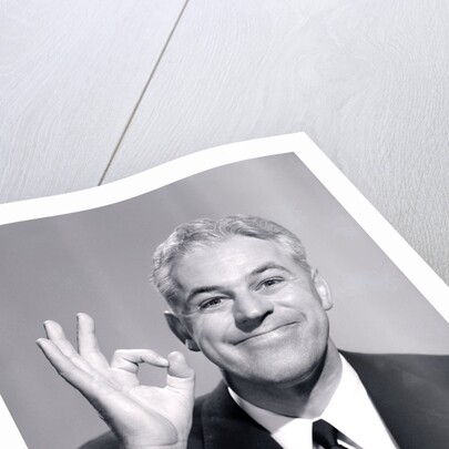 1950s Portrait Of Happy Man Businessman Slesman Making An Ok Hand Sign by Anonymous