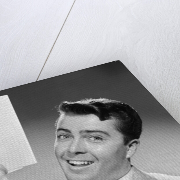 1950s Young Businessman Holding Up Handful Of Papers by Anonymous