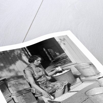 1930s Woman Farm Wife Sitting Outside Of Hen House Doorway Putting Eggs From Pails Into Shipping Crates by Anonymous