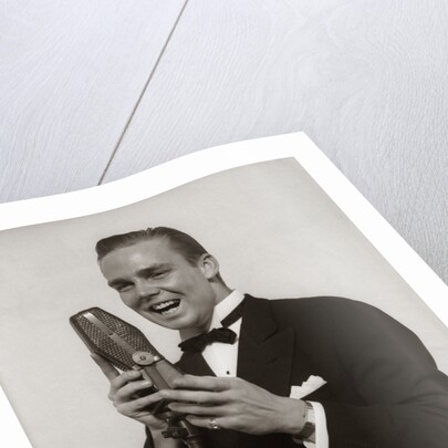 1920s 1930s Man Radio Singer Entertainer Crooner In Tuxedo Singing Into Microphone by Anonymous