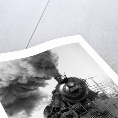 1920s 1930s Steam Engine Pulling Passenger Train Smoke Billowing From Exhaust Stack by Anonymous