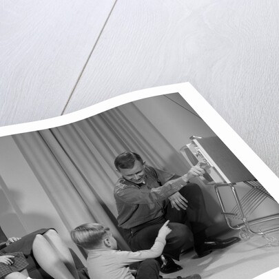 1960s Family Mother Father Son Daughter Watching Television In Living Room Indoor by Anonymous