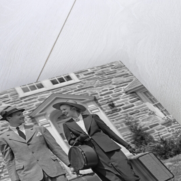 1930s 1940s Couple Leaving Home Carrying Luggage by Anonymous