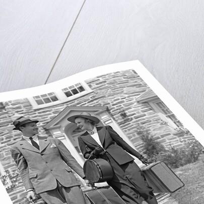 1930s 1940s Couple Leaving Home Carrying Luggage by Anonymous