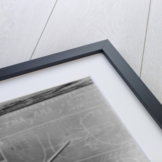1930s Man Teacher Looking At Camera With Pointer At Blackboard by Anonymous