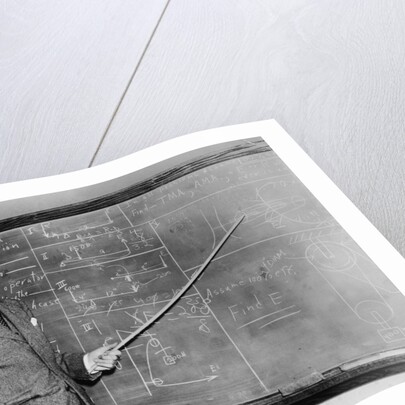 1930s Man Teacher Looking At Camera With Pointer At Blackboard by Anonymous