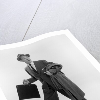 1950s Surprised Businessman Holding Briefcase Taking A Step Forward Looking Back by Anonymous
