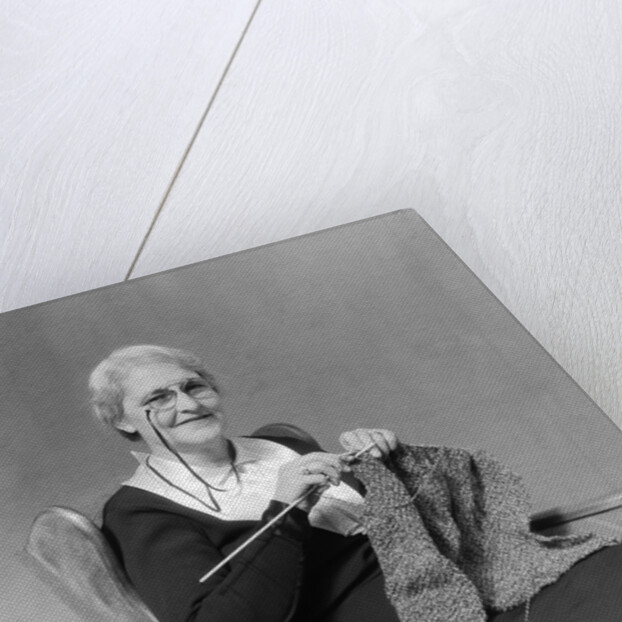 1930s Elderly Woman Wearing Pince-Nez Glasses Sitting Knitting by Anonymous