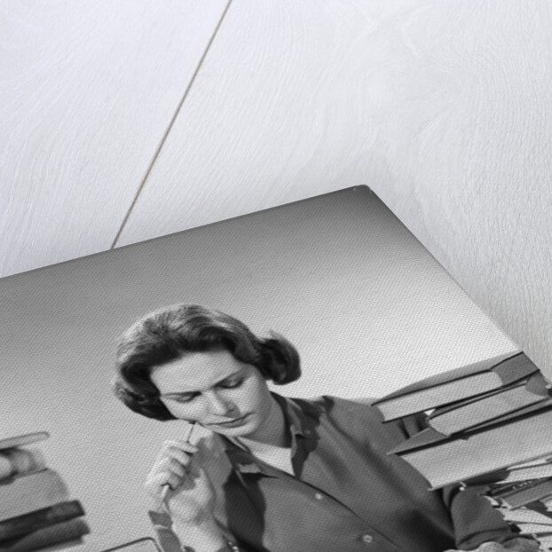 1950s 1960s College Woman Studying Surrounded All Around By Piles Of Books by Anonymous