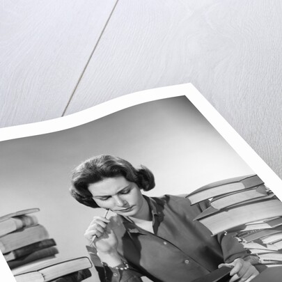 1950s 1960s College Woman Studying Surrounded All Around By Piles Of Books by Anonymous