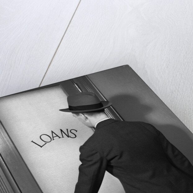 1930s 1940s Man In Suit And Hat Opening Door Marked Loans by Anonymous