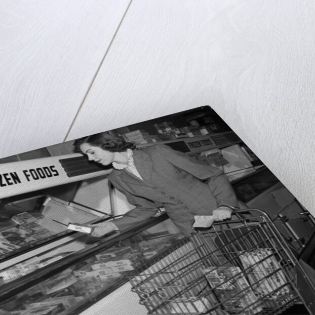 1950s Woman Shopping Frozen Food Section Of Grocery Store by Anonymous