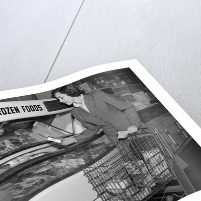 1950s Woman Shopping Frozen Food Section Of Grocery Store by Anonymous