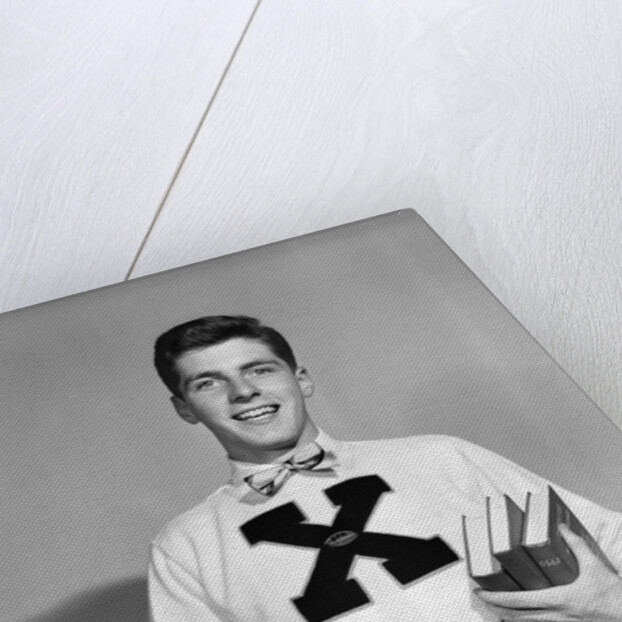 1940s 1950s Portrait Boy Student Carrying Books Wearing Football Letter Sweater by Anonymous