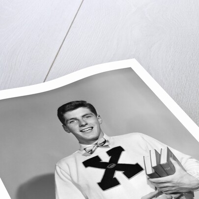 1940s 1950s Portrait Boy Student Carrying Books Wearing Football Letter Sweater by Anonymous