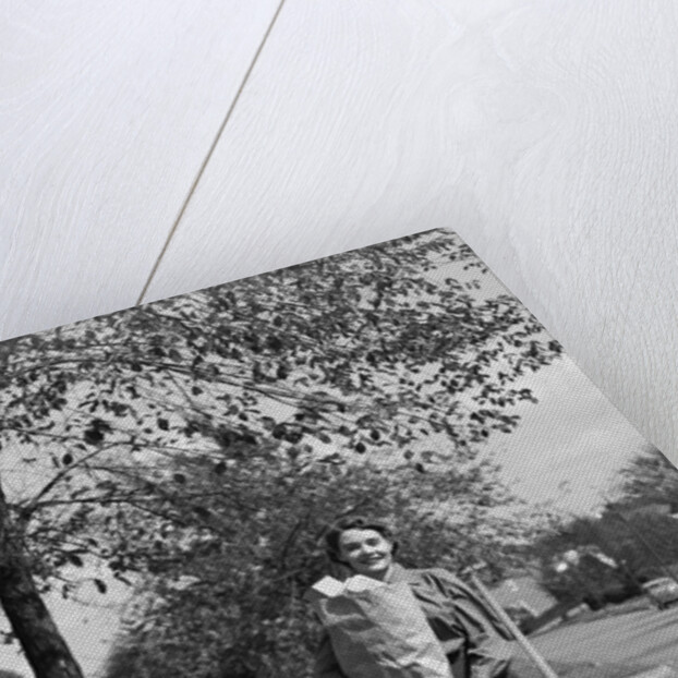 1950s Woman Walking On Sidewalk Carrying A Grocery Bag Full Of Food by Anonymous