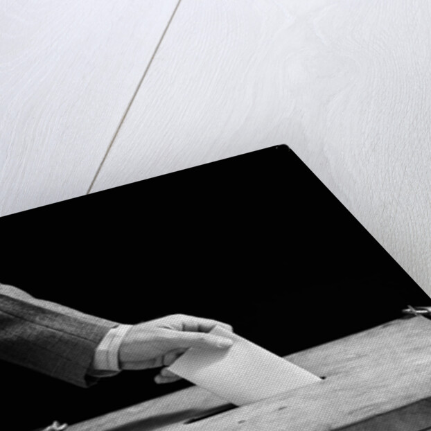 1930s 1940s Man's Hand Putting Ballot In Slot In Box by Anonymous